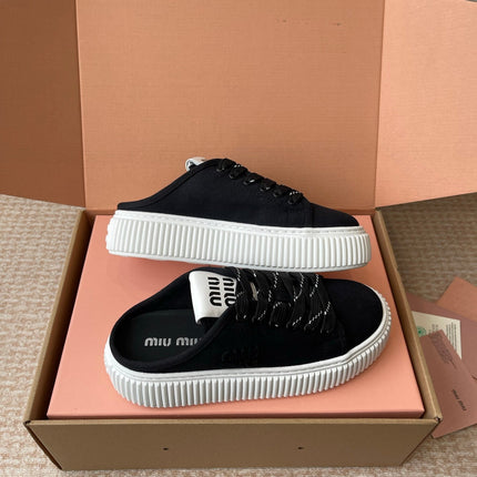 WASH SNEAKER MULES IN BLACK DENIM