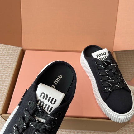 WASH SNEAKER MULES IN BLACK DENIM