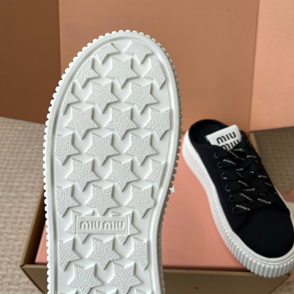 WASH SNEAKER MULES IN BLACK DENIM