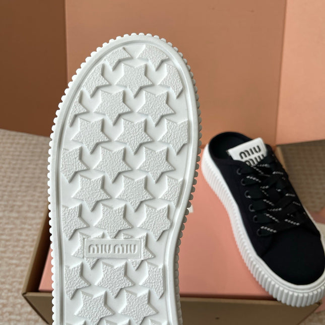 WASH SNEAKER MULES IN BLACK DENIM