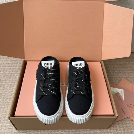 WASH SNEAKER MULES IN BLACK DENIM