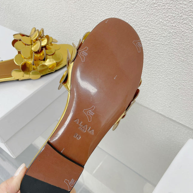 ALAIA FLAT MULE IN GOLDEN GLOSSY LAMBSKIN