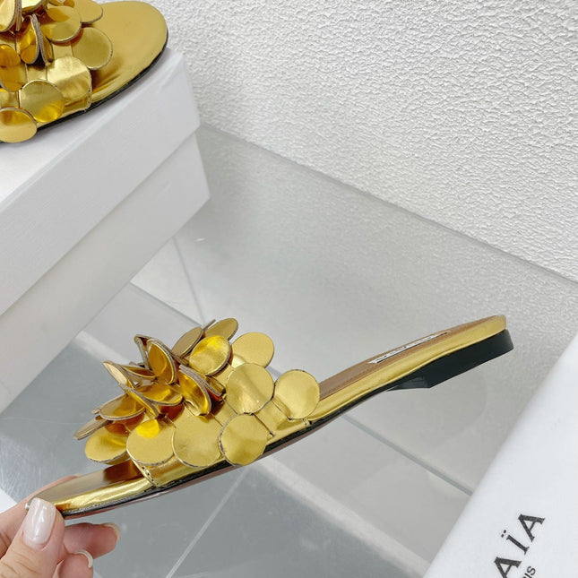 ALAIA FLAT MULE IN GOLDEN GLOSSY LAMBSKIN