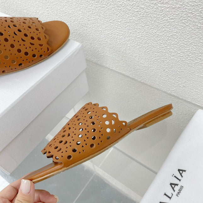ALAIA VIENNE FLAT MULES IN CHOCOLATE BROWN LAMBSKIN