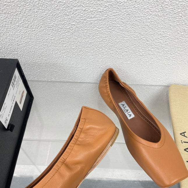 ALAIA BALLET FLATS IN COPPER BROWN CALFSKIN