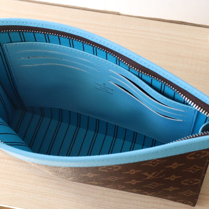 LV 25S POCHETTE VOYAGE 26 IN GASTON BLUE MONOGRAM MACASSAR COATED CANVAS