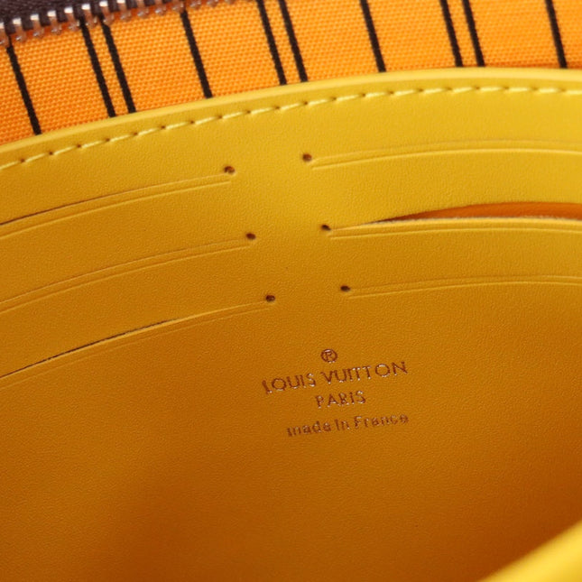 LV 25S POCHETTE VOYAGE 26 IN YELLOW MONOGRAM MACASSAR COATED CANVAS