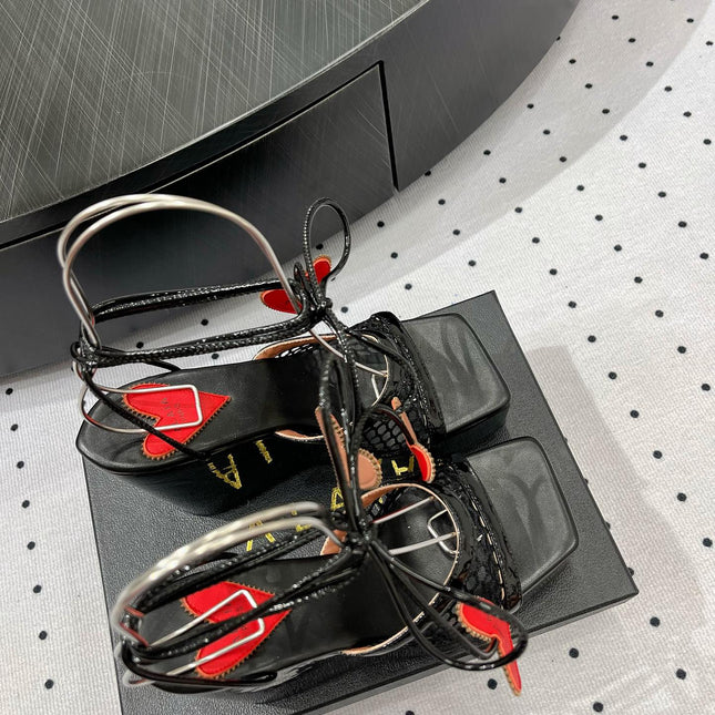 ALAIA BANQUET WEDGE SANDALS IN BLACK LAMBSKIN WITH RED HEART