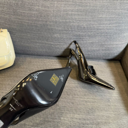 POINTED-TOE SLINGBACK PUMPS IN BLACK SHINY CALFSKIN