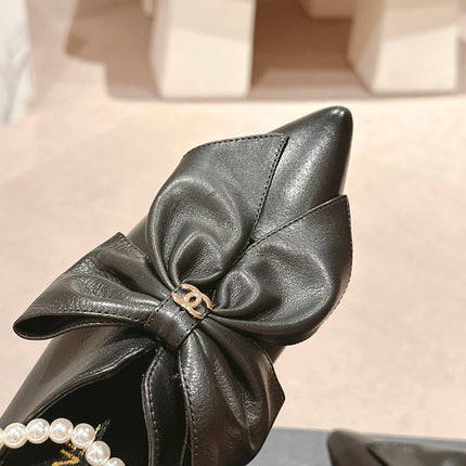 SHORT BOOTS IN BLACK SHEEPSKIN WITH BOW