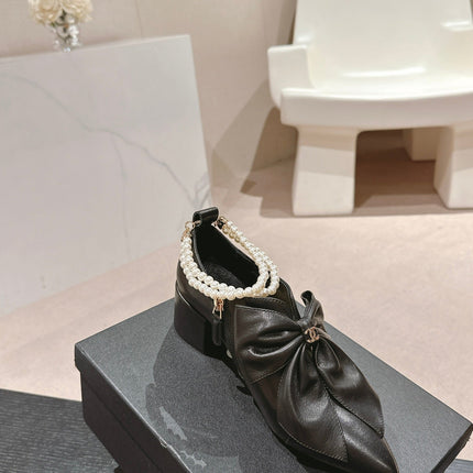 SHORT BOOTS IN BLACK SHEEPSKIN WITH BOW