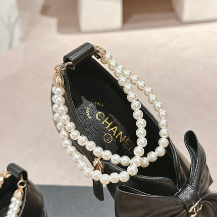 SHORT BOOTS IN BLACK SHEEPSKIN WITH BOW