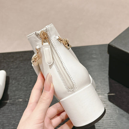 SHORT BOOTS IN WHITE SHEEPSKIN WITH BOW