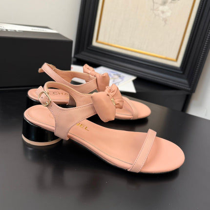 FLAT SANDALS IN PEACHY PINK CALFSKIN WITH BOW