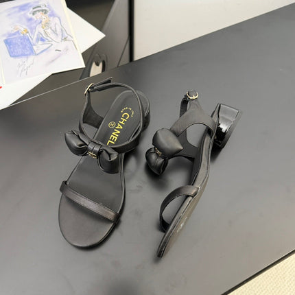 FLAT SANDALS IN BLACK CALFSKIN WITH BOW