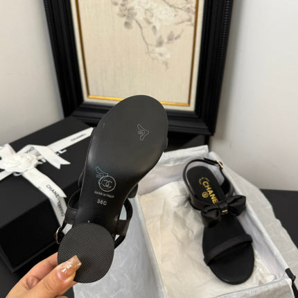 MID HEEL SANDALS IN BLACK CALFSKIN WITH BOW