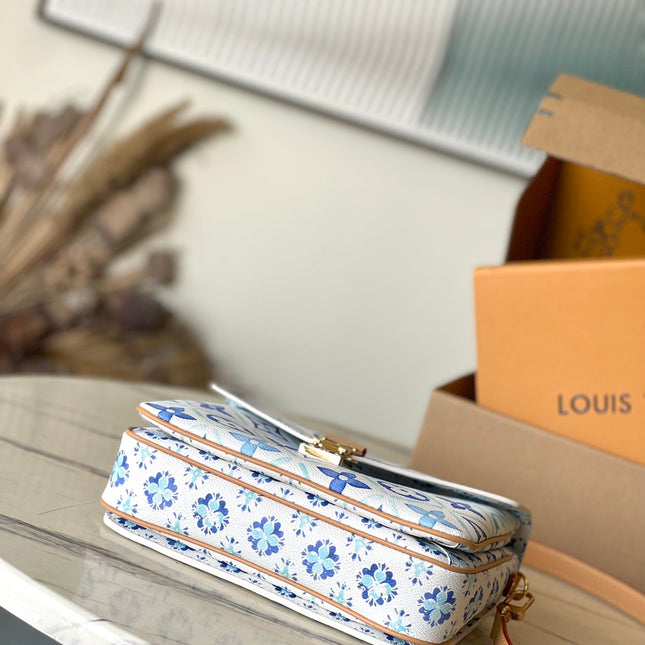 POCHETTE MÉTIS 25 IN LAGOON BLUE MONOGRAM TILES CANVAS GOLD HARDWARE