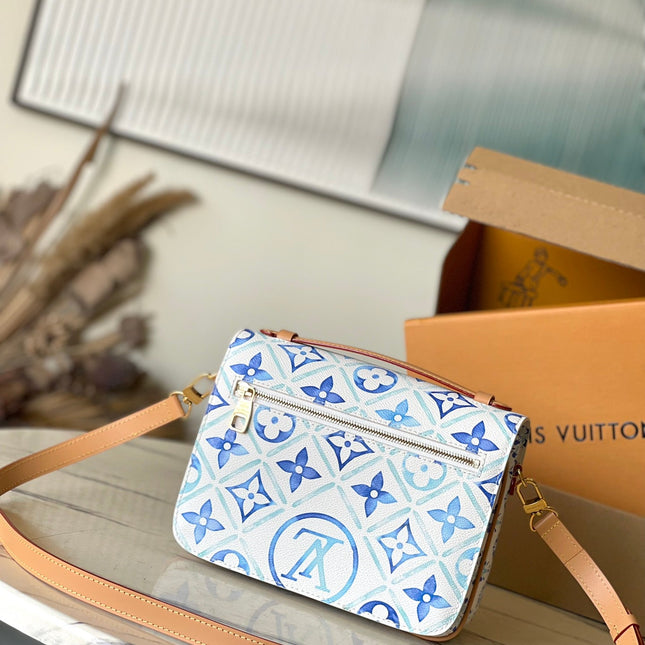 POCHETTE MÉTIS 25 IN LAGOON BLUE MONOGRAM TILES CANVAS GOLD HARDWARE