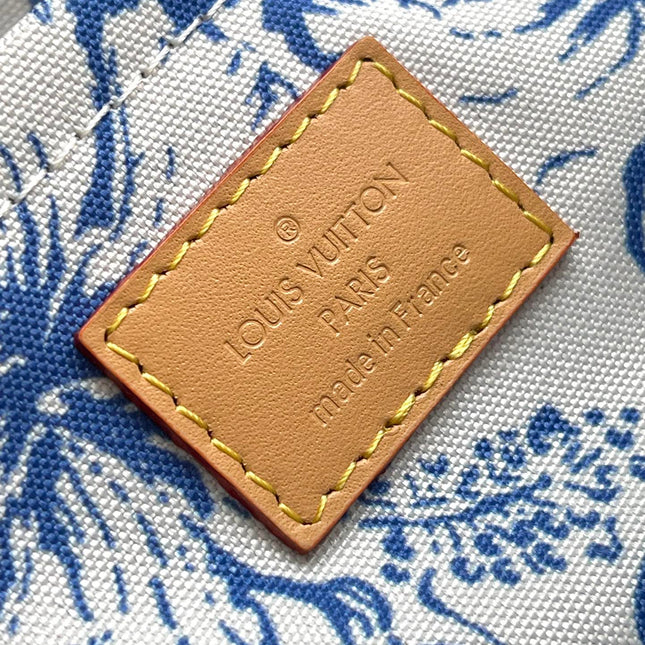 ONTHEGO EAST WEST 25 IN LAGOON BLUE MONOGRAM TILES CANVAS