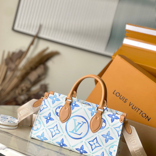 ONTHEGO EAST WEST 25 IN LAGOON BLUE MONOGRAM TILES CANVAS