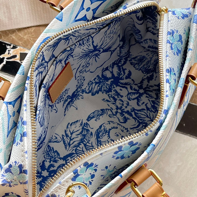 ONTHEGO EAST WEST 25 IN LAGOON BLUE MONOGRAM TILES CANVAS