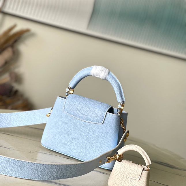 CAPUCINES MINI 21 IN CANDY BLUE TAURILLON GOLD HARDWARE