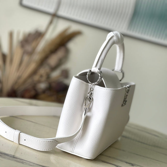 CAPUCINES EAST-WEST 33 IN WHITE CALFSKIN SILVER HARDWARE
