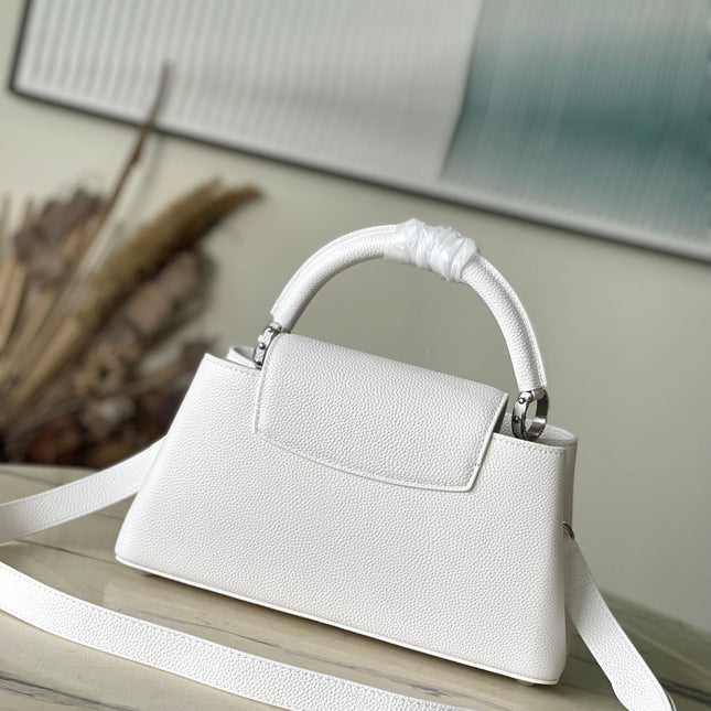 CAPUCINES EAST-WEST 33 IN WHITE CALFSKIN SILVER HARDWARE