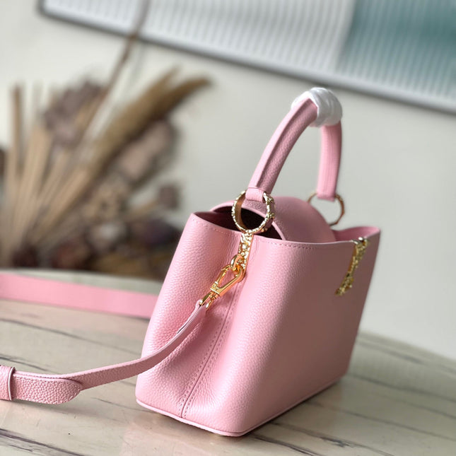 CAPUCINES EAST-WEST 33 IN BLUSH PINK CALFSKIN GOLD HARDWARE