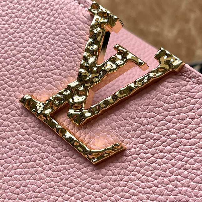 CAPUCINES EAST-WEST 33 IN BLUSH PINK CALFSKIN GOLD HARDWARE