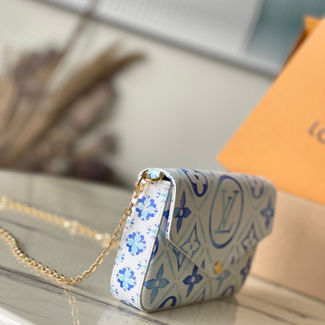 FÉLICIE POCHETTE 21 IN LAGOON BLUE MONOGRAM TILES CANVAS