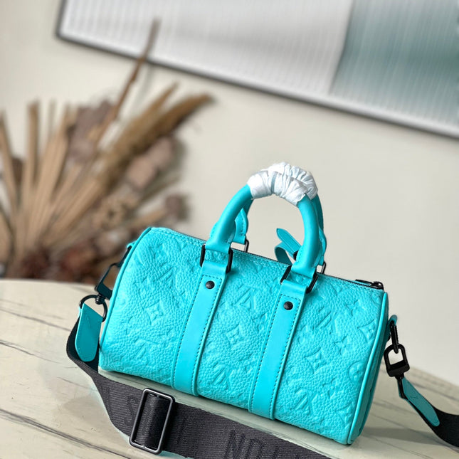 KEEPALL BANDOULIÈRE 25 IN TURQUOISE BLUE MONOGRAM EMBOSSED CALFSKIN