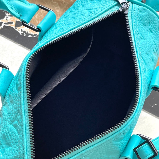 KEEPALL BANDOULIÈRE 25 IN TURQUOISE BLUE MONOGRAM EMBOSSED CALFSKIN