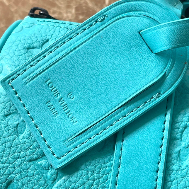 KEEPALL BANDOULIÈRE 25 IN TURQUOISE BLUE MONOGRAM EMBOSSED CALFSKIN