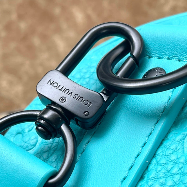 KEEPALL BANDOULIÈRE 25 IN TURQUOISE BLUE MONOGRAM EMBOSSED CALFSKIN
