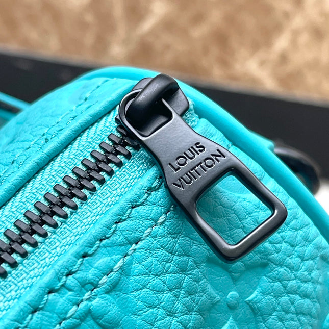 KEEPALL BANDOULIÈRE 25 IN TURQUOISE BLUE MONOGRAM EMBOSSED CALFSKIN