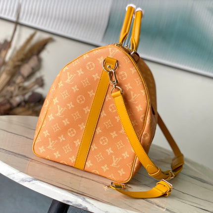 KEEPALL BANDOULIÈRE 55 IN ORANGE MONOGRAM HERITAGE CANVAS