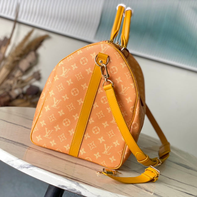 KEEPALL BANDOULIÈRE 55 IN ORANGE MONOGRAM HERITAGE CANVAS