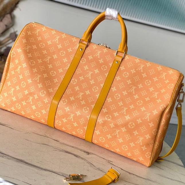KEEPALL BANDOULIÈRE 55 IN ORANGE MONOGRAM HERITAGE CANVAS
