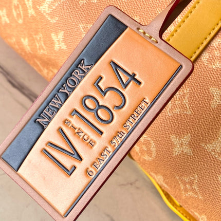 KEEPALL BANDOULIÈRE 55 IN ORANGE MONOGRAM HERITAGE CANVAS