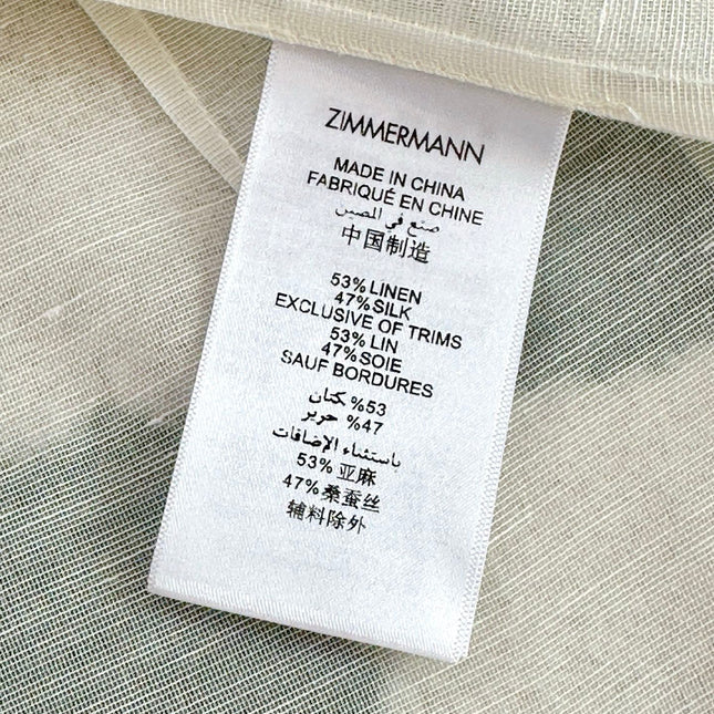 WHITE DRESSY TOP WITH BLACK TIE-NECK