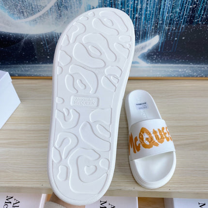 SLIDES SANDAL IN WHITE TPU WITH BOLD ORANGE LOGO GRAPHIC IN STRAP