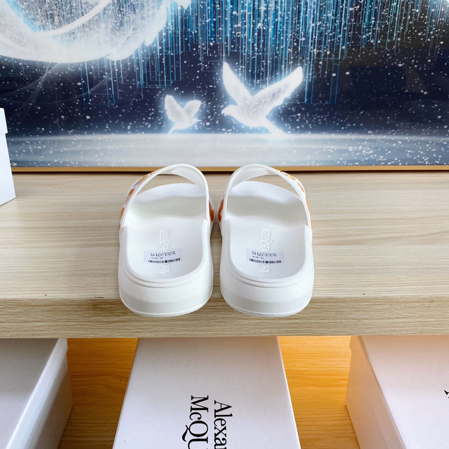 SLIDES SANDAL IN WHITE TPU WITH BOLD ORANGE LOGO GRAPHIC IN STRAP