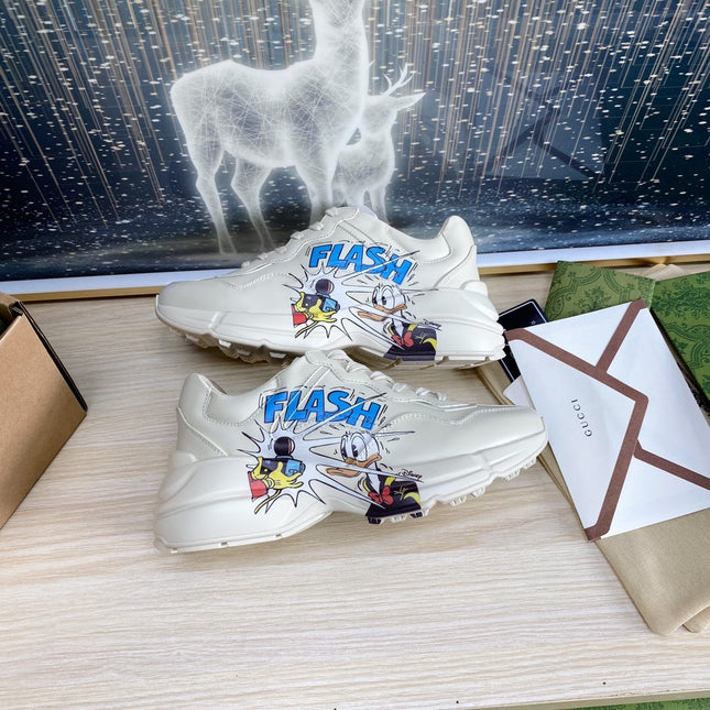 GG COUPLE TRAINER WHITE CALFSKIN WITH DONALD DUCK ICON