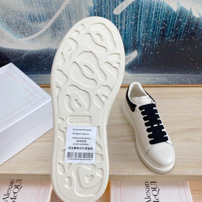 OVERSIZED SNEAKERS IN WHITE TEXTURED CALFSKIN BLACK HEEL BLACK LACES