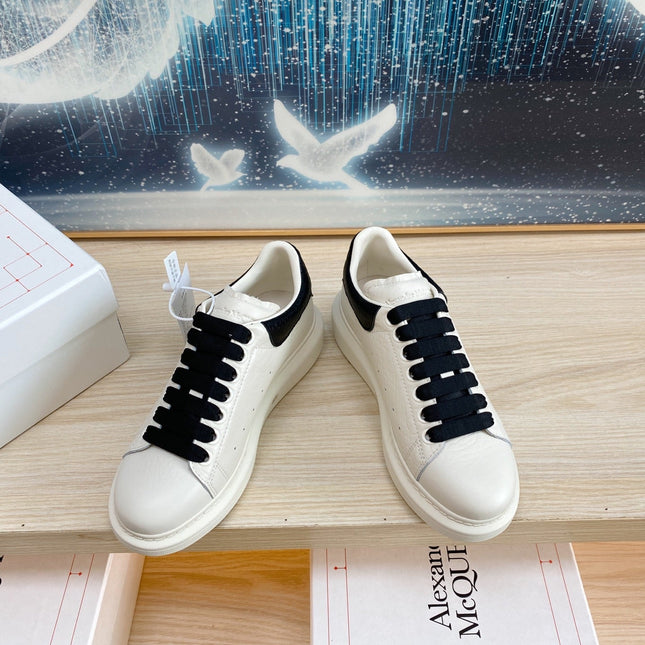 OVERSIZED SNEAKERS IN WHITE TEXTURED CALFSKIN BLACK HEEL BLACK LACES