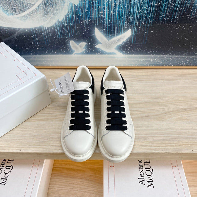 OVERSIZED SNEAKERS IN WHITE TEXTURED CALFSKIN BLACK HEEL BLACK LACES