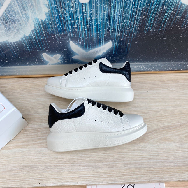 OVERSIZED SNEAKERS IN WHITE TEXTURED CALFSKIN BLACK HEEL BLACK LACES
