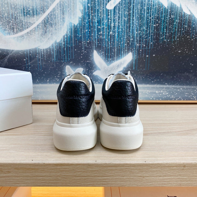 OVERSIZED SNEAKERS IN WHITE TEXTURED CALFSKIN BLACK HEEL BLACK LACES