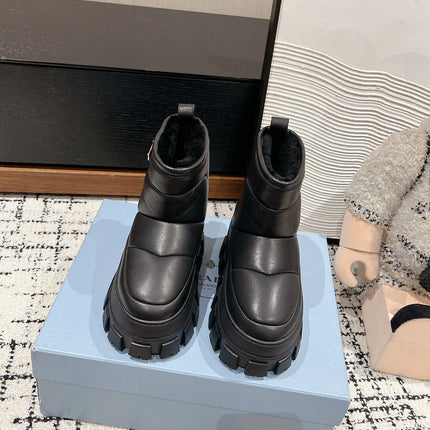 MONOLITH ANKLE BOOTS IN BLACK CALFSKIN AND LAMB FUR LINING